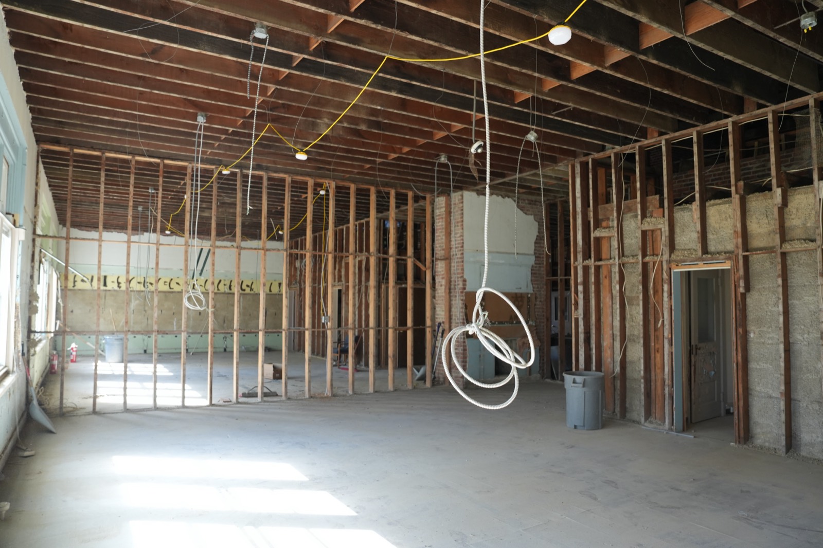 A classroom stripped back to its wooden framing